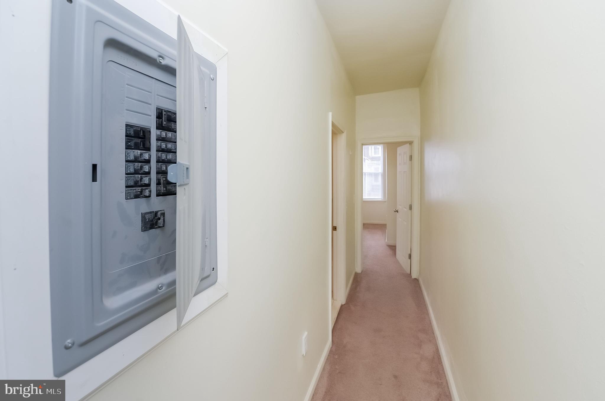 3733 North 15th Street, Unit 2 Philadelphia, PA 19140 - Photo 2 of 12 a view of a hallway with wooden floor and closet