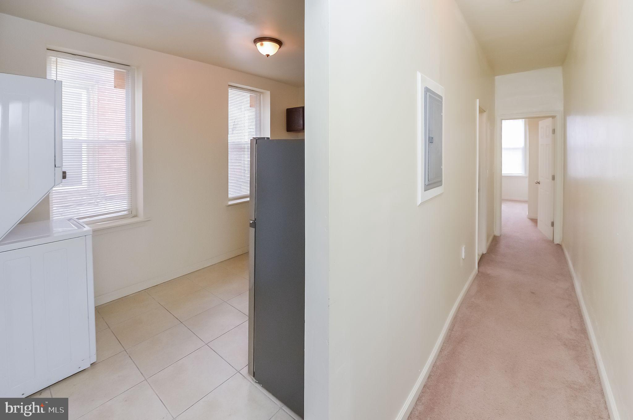 3733 North 15th Street, Unit 2 Philadelphia, PA 19140 - Photo 3 of 12 a view of a hallway with front door