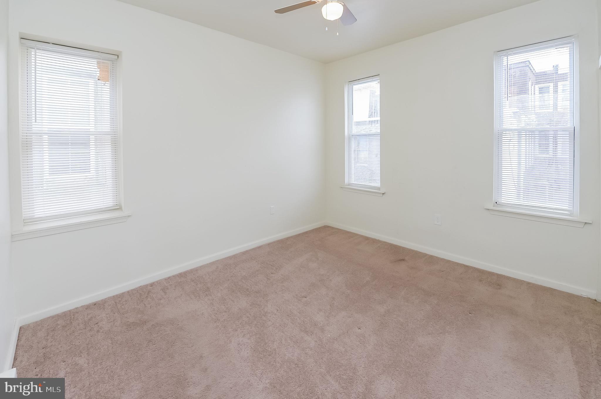 3733 North 15th Street, Unit 2 Philadelphia, PA 19140 - Photo 7 of 12 an empty room with windows