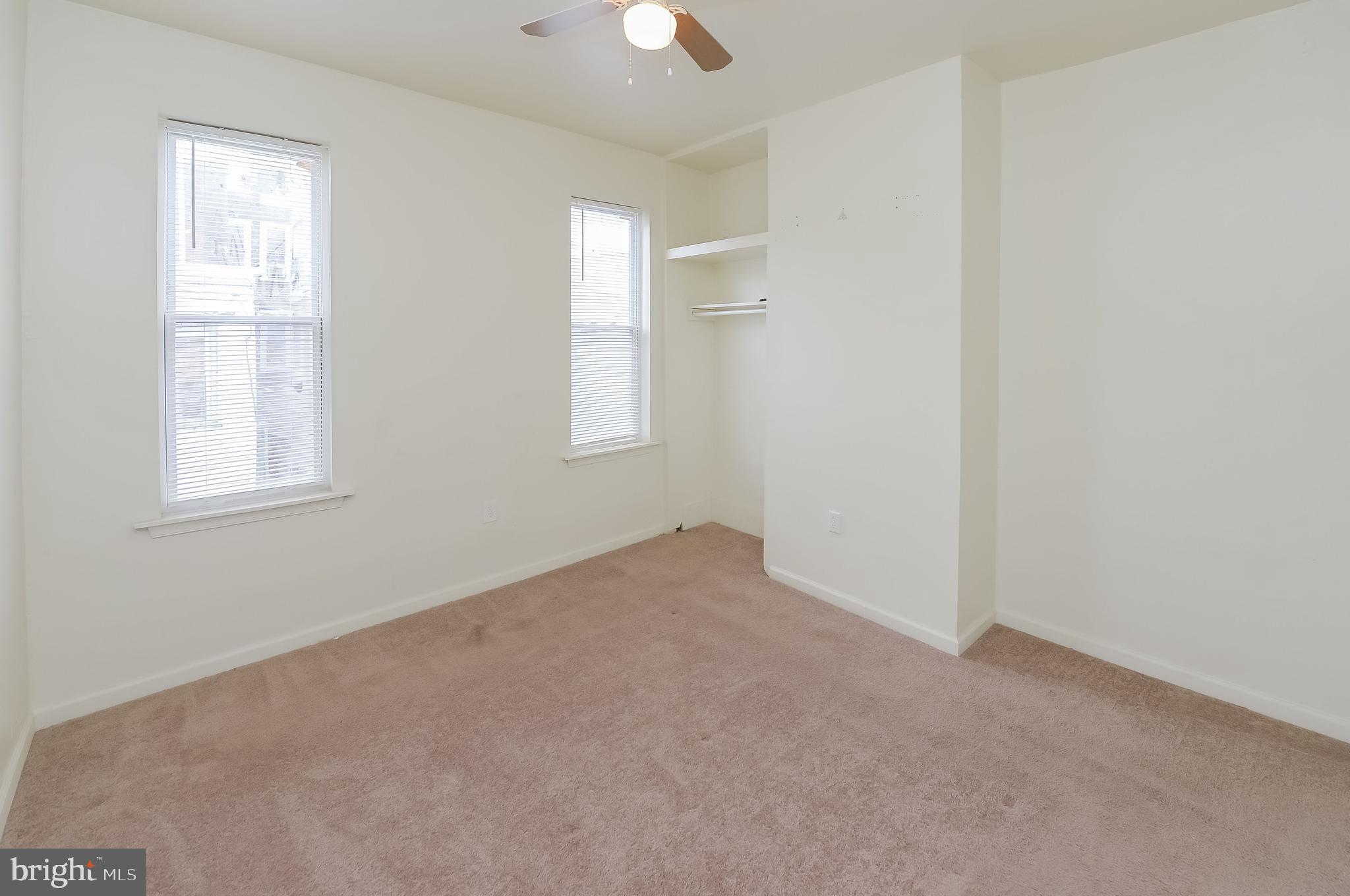 3733 North 15th Street, Unit 2 Philadelphia, PA 19140 - Photo 8 of 12 an empty room with windows and closet