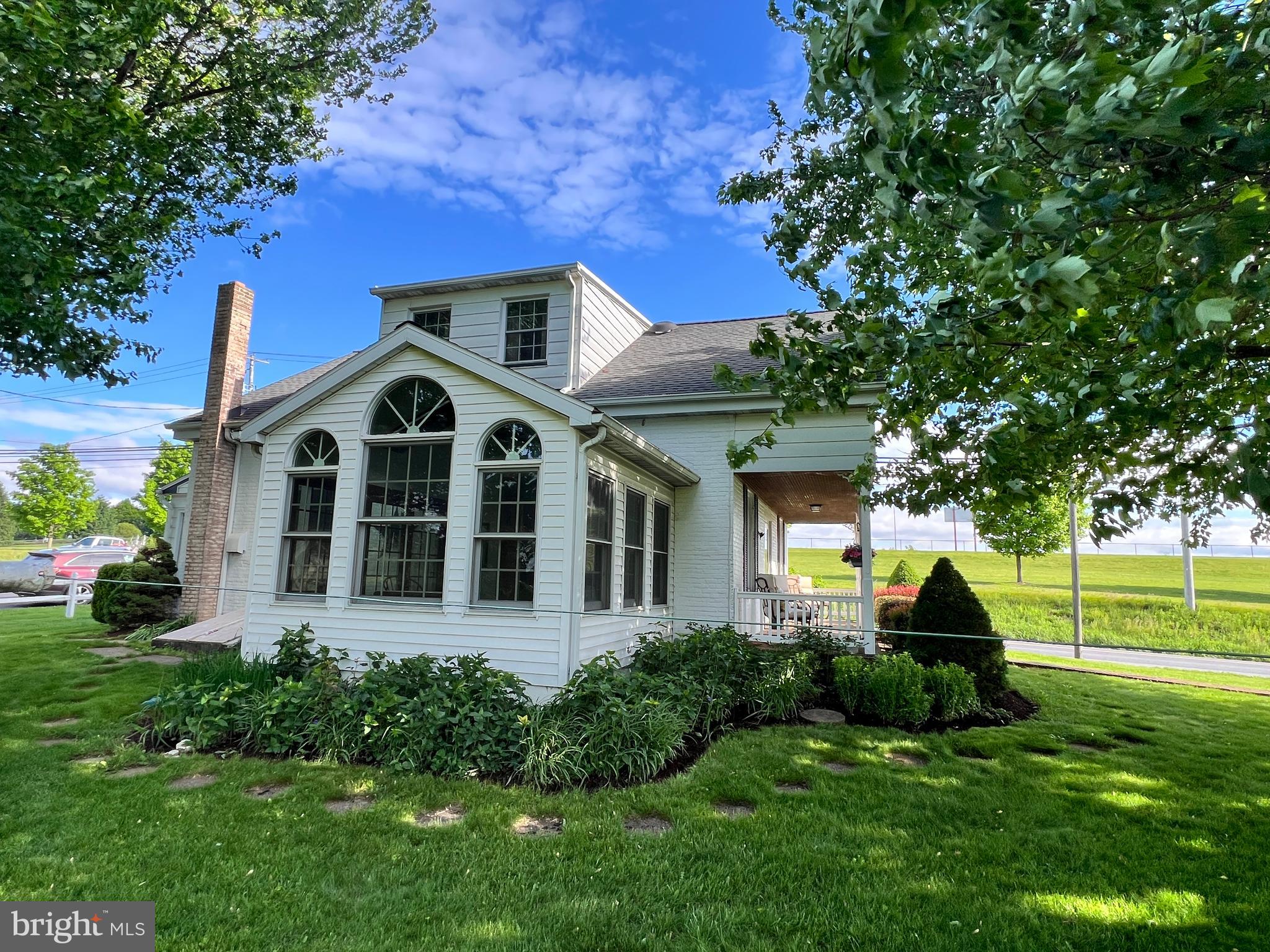 252 Doe Run Road Manheim, PA 17545 - Photo 3 of 32 a front view of a house with a yard