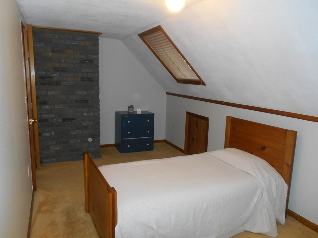 12 Birch Bluff Road Montgomery, MA 01085 - Photo 21 of 37 a bedroom with a bed and a dresser