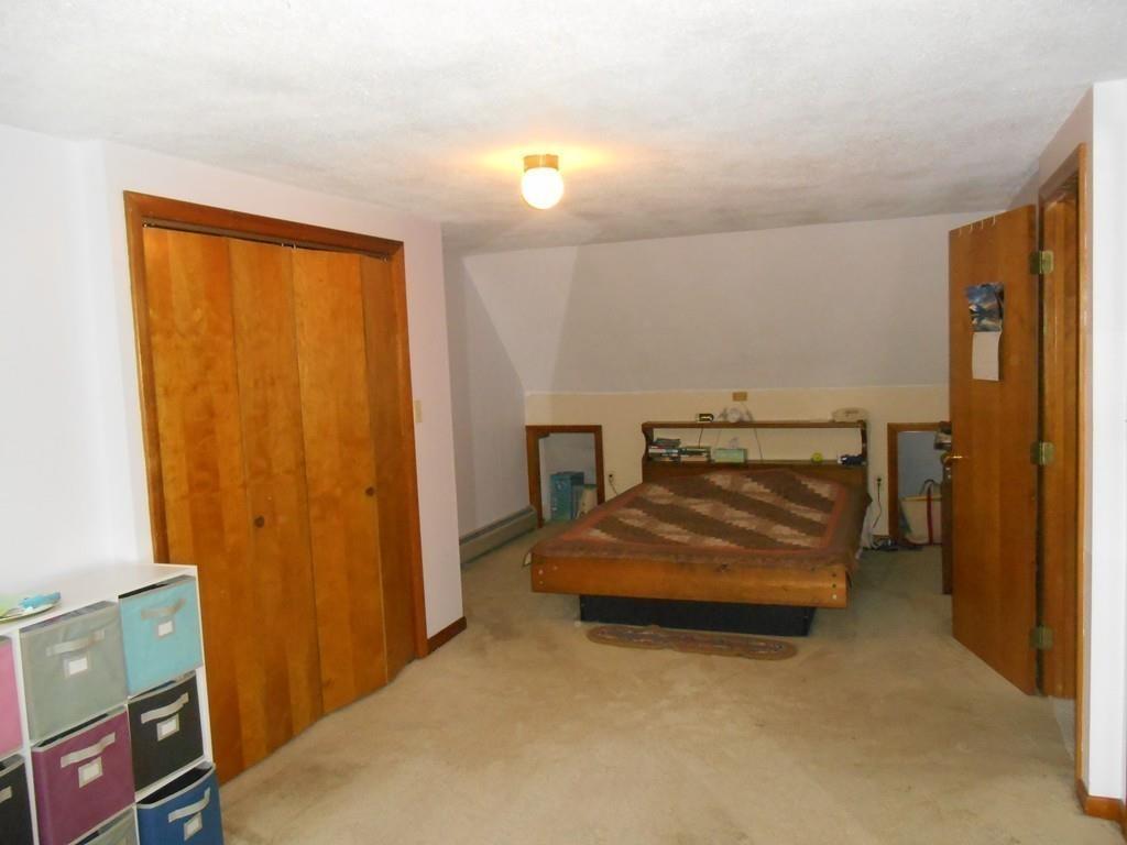 12 Birch Bluff Road Montgomery, MA 01085 - Photo 23 of 37 a bedroom with a bed and a window