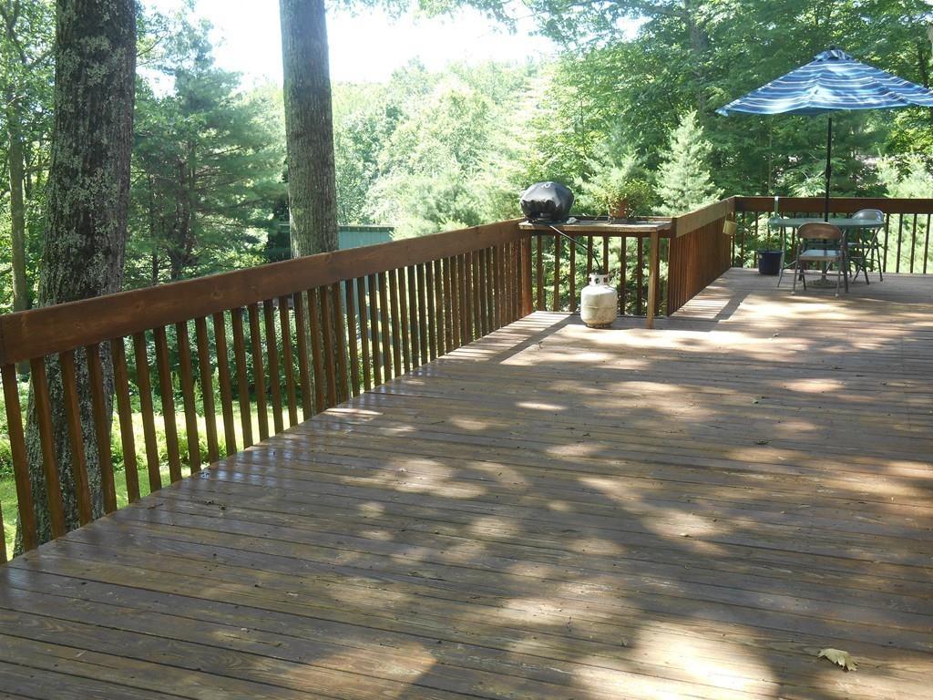 12 Birch Bluff Road Montgomery, MA 01085 - Photo 34 of 37 a view of a wooden deck next to a yard