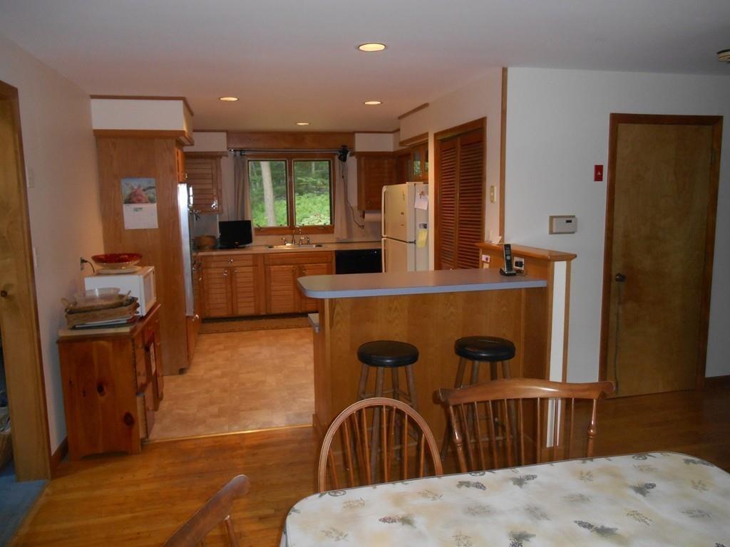 12 Birch Bluff Road Montgomery, MA 01085 - Photo 7 of 37 a kitchen with stainless steel appliances kitchen island granite countertop a refrigerator and a stove top oven