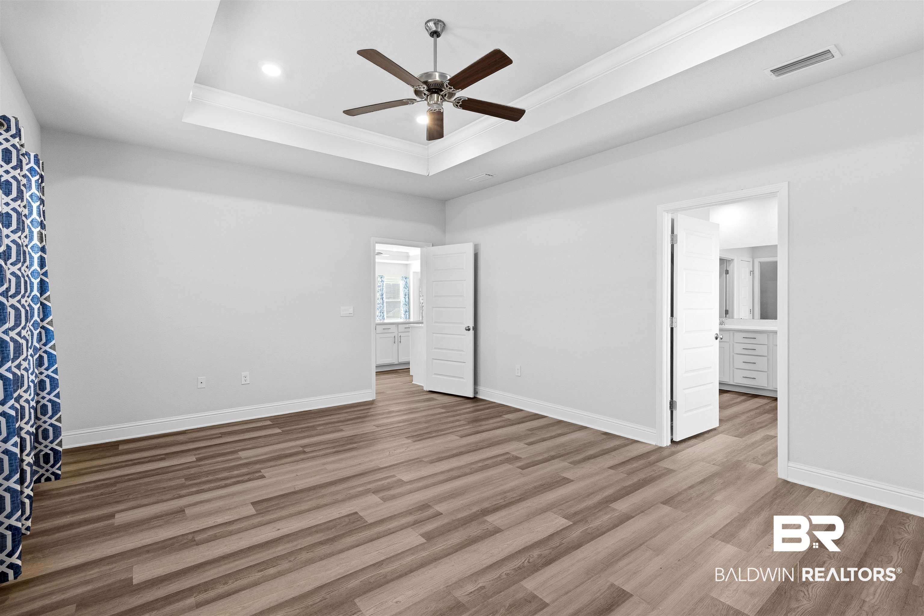 485 Shepard Street Gulf Shores, AL 36542 - Photo 20 of 53 Primary bedroom with ornamental molding, light wood-type flooring, a ceiling fan, ensuite bathroom, and recessed lighting