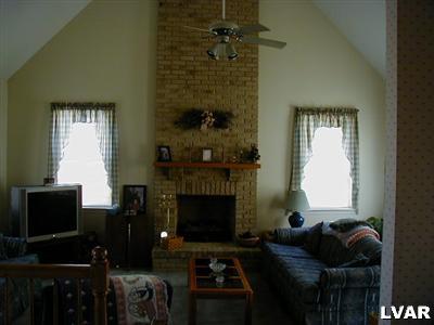 4985 Harvey Road Bethlehem, PA 18020 - Photo 3 of 8 Beatiful 2 story family room with dramatic floor to ceiling brick gas fireplace.
