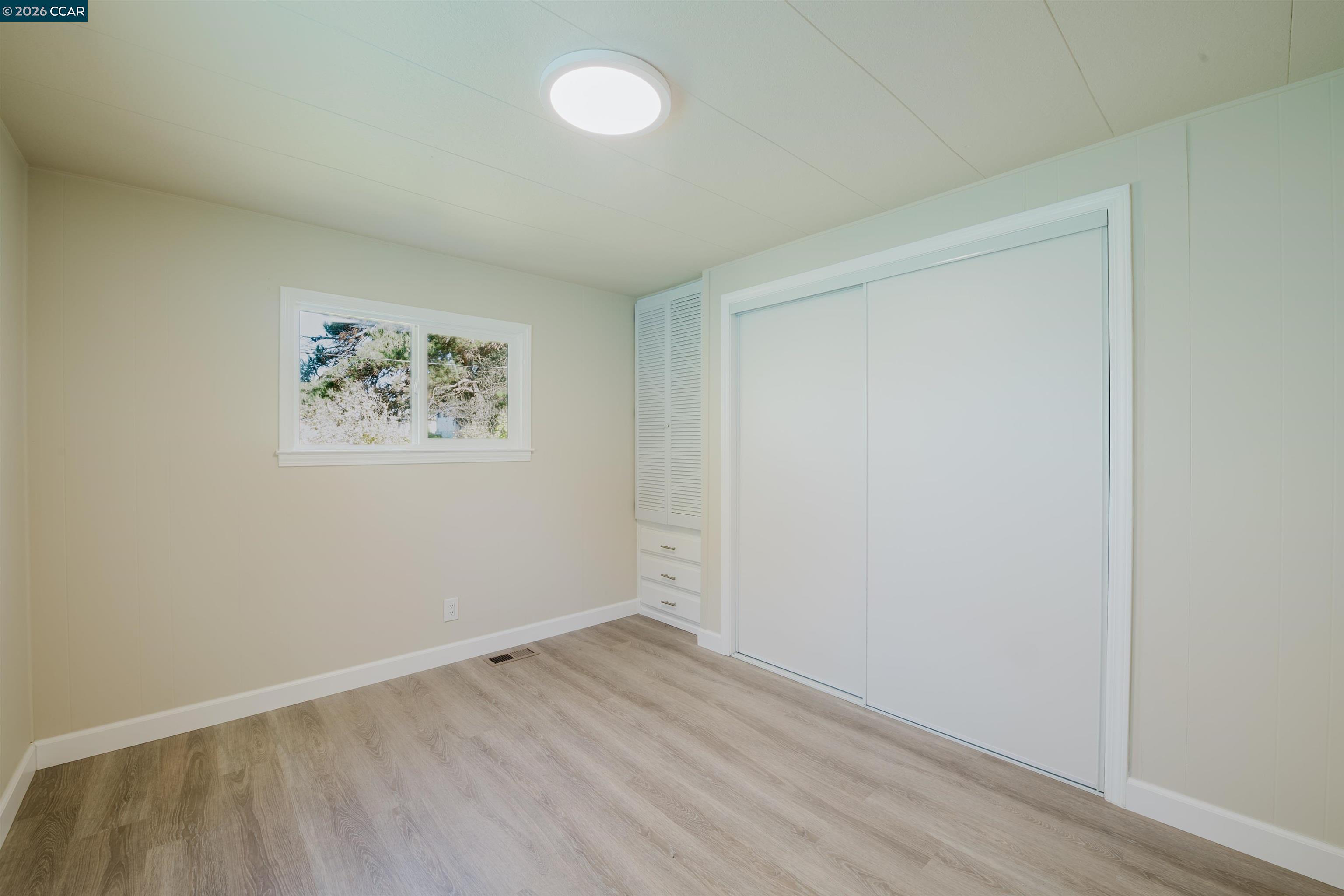 2990 San Pablo Dam Road, Unit 2 San Pablo, CA 94803 - Photo 12 of 41 an empty room with a door and wooden floor
