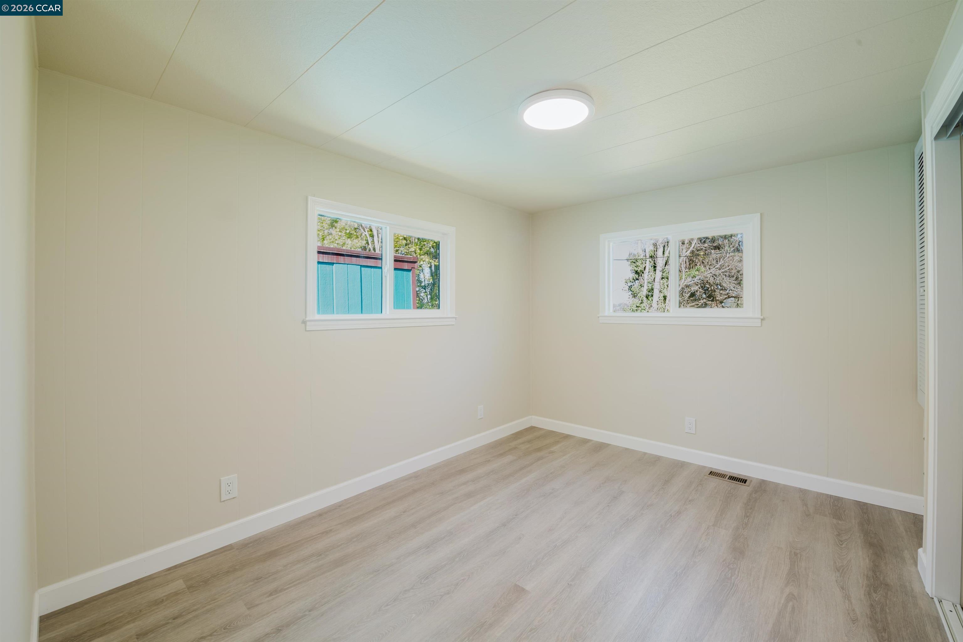 2990 San Pablo Dam Road, Unit 2 San Pablo, CA 94803 - Photo 14 of 41 an empty room with a painting and a window