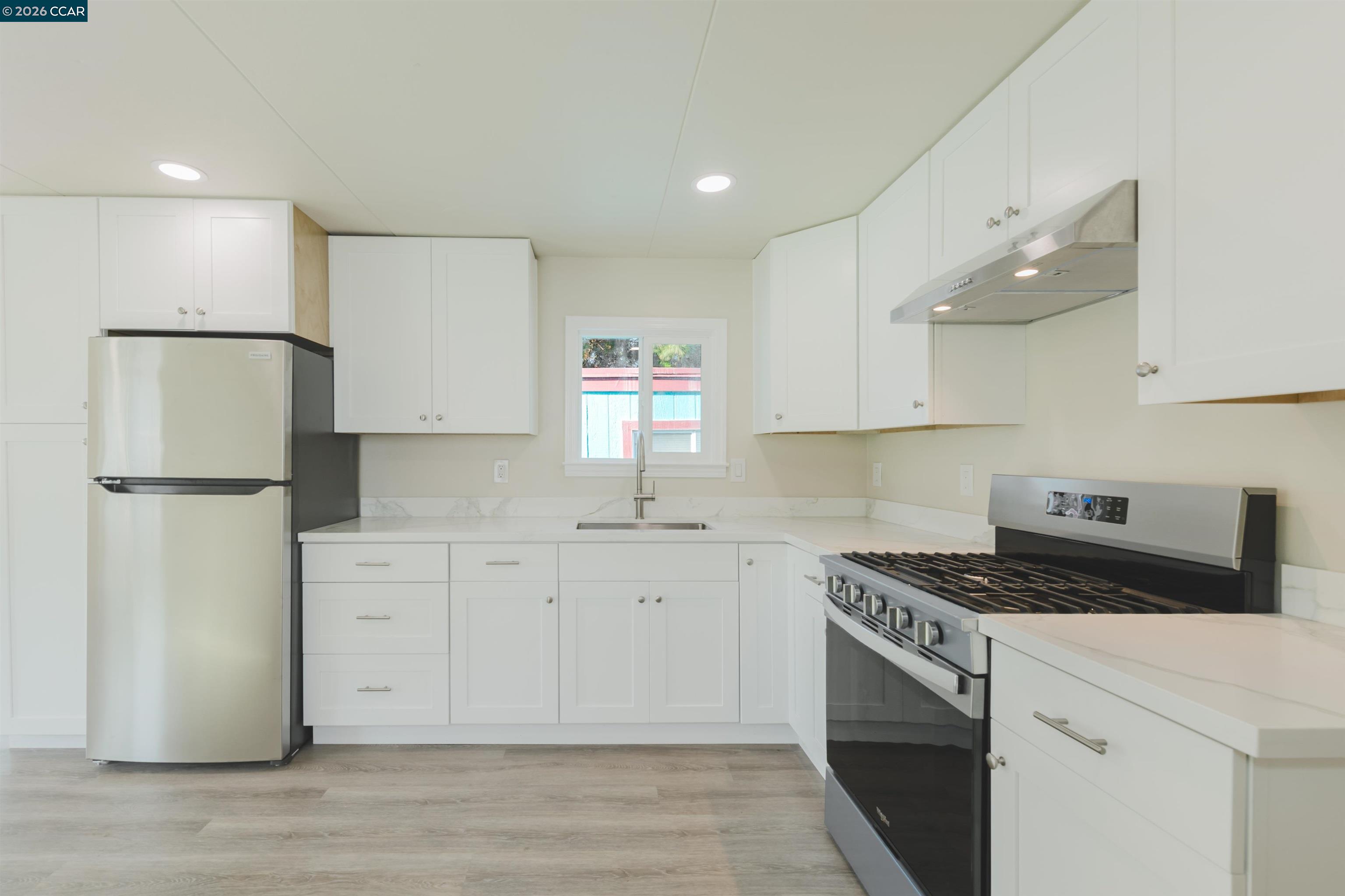 2990 San Pablo Dam Road, Unit 2 San Pablo, CA 94803 - Photo 41 of 41 a kitchen with granite countertop a sink cabinets stainless steel appliances and a window