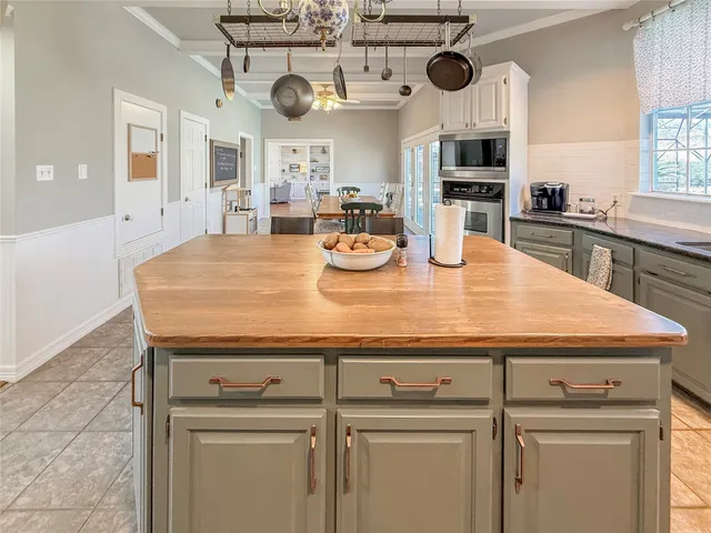 a kitchen with appliances cabinets and furniture