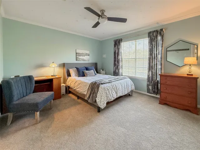 a bedroom with a bed and with furniture