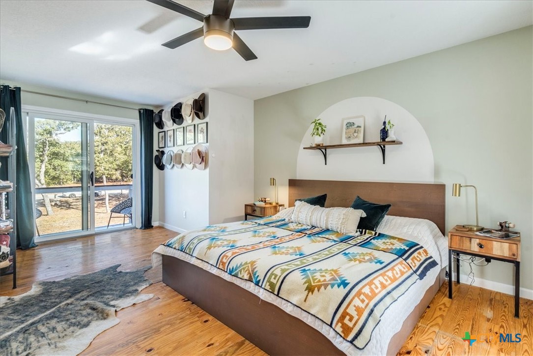 171 Pin Oak Crossing Elgin, TX 78621 - Photo 20 of 38 a bedroom with a large bed and a window