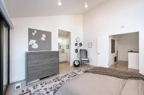 a bedroom with a bed and a dresser