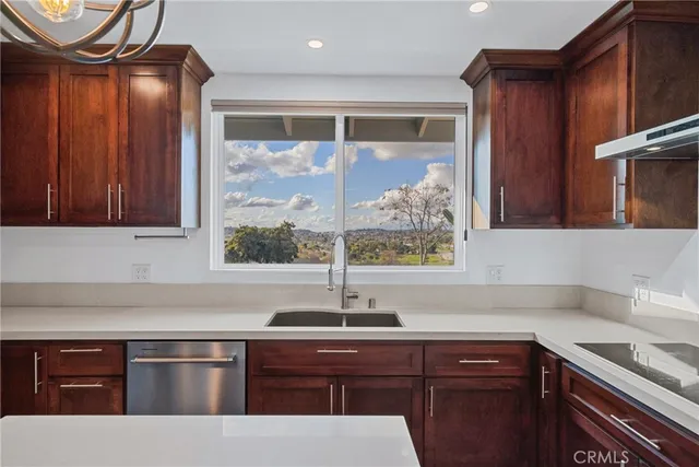a view of a livingroom with a ceiling fan and window