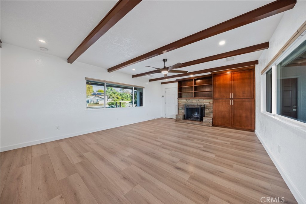 12646 10th Street Yucaipa, CA 92399 - Photo 14 of 72 a view of empty room with wooden floor and fireplace