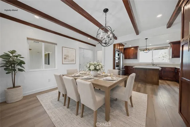 a kitchen with stainless steel appliances granite countertop a sink a stove and a microwave