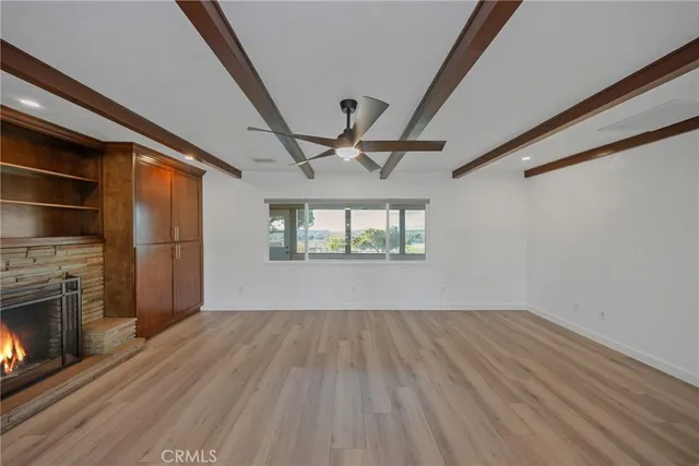 a view of a house with a swimming pool and a yard