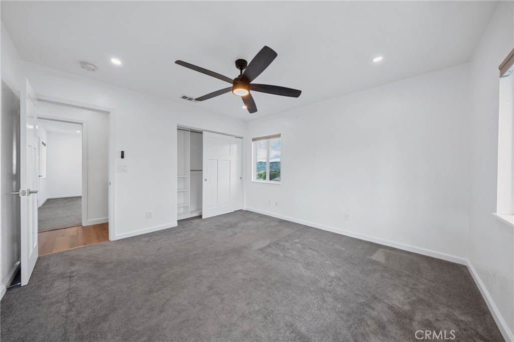 12646 10th Street Yucaipa, CA 92399 - Photo 29 of 72 a view of a livingroom with a ceiling fan and window