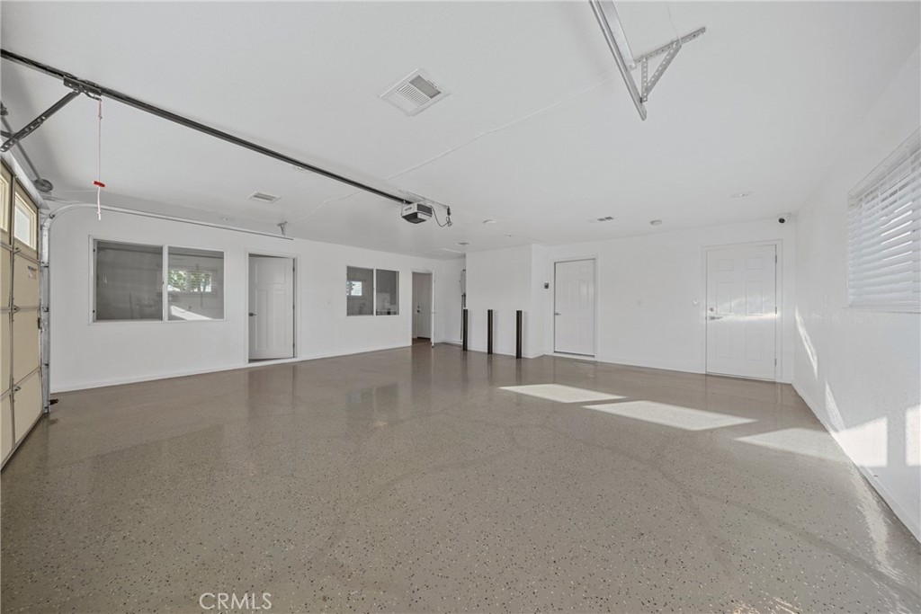 12646 10th Street Yucaipa, CA 92399 - Photo 36 of 72 a view of a livingroom with an empty space and a window