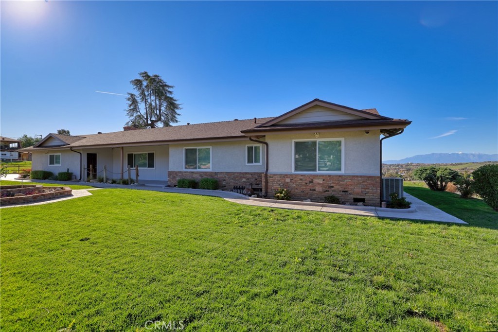 12646 10th Street Yucaipa, CA 92399 - Photo 59 of 72 a front view of a house with a garden