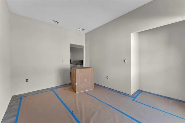 a view of walk in closet with wooden floor