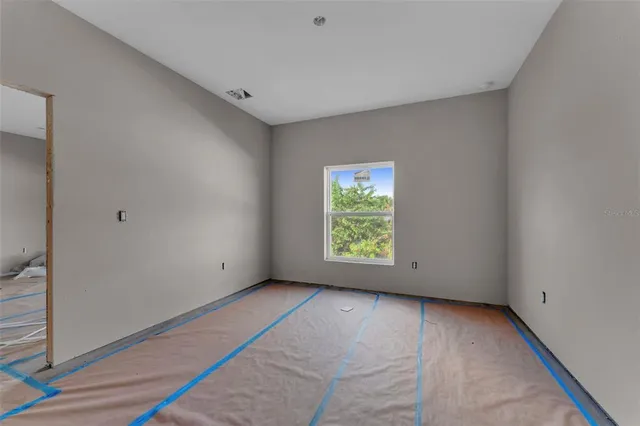 a view of an empty room with a window