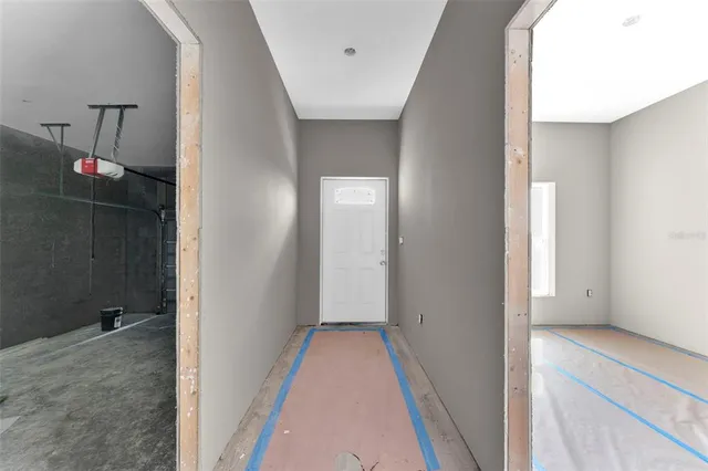 a view of a hallway with a white walls