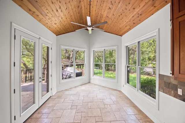 a view of a entryway with furniture and floor to ceiling window