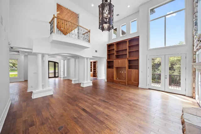 a kitchen with stainless steel appliances granite countertop a sink counter top space cabinets and a stove top oven