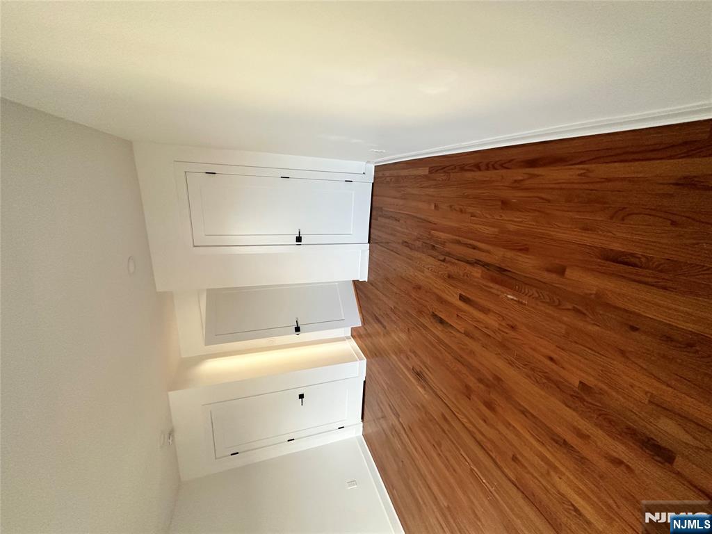 60 Passaic Street Garfield, NJ 07026 - Photo 4 of 14 a view of empty room with wooden floor