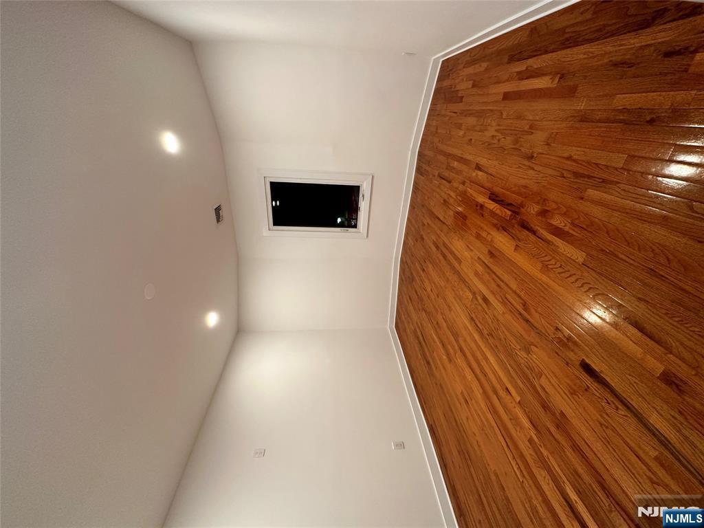 60 Passaic Street Garfield, NJ 07026 - Photo 5 of 14 a view of empty room with wooden floor
