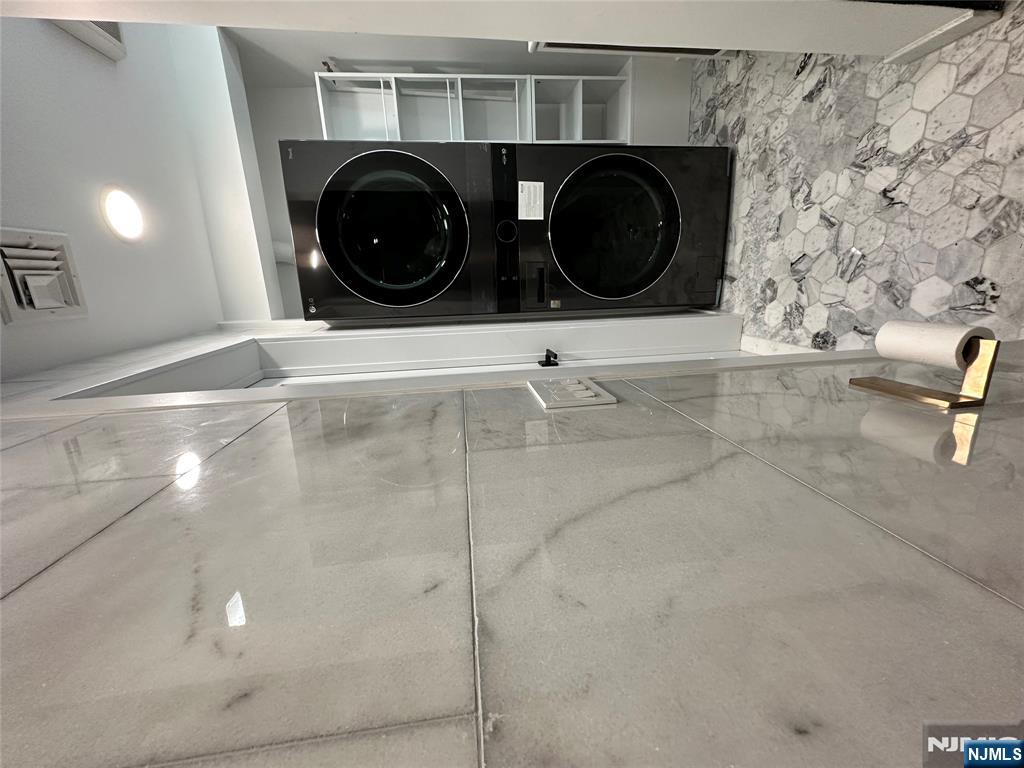 60 Passaic Street Garfield, NJ 07026 - Photo 7 of 14 a bathroom with a sink and a mirror