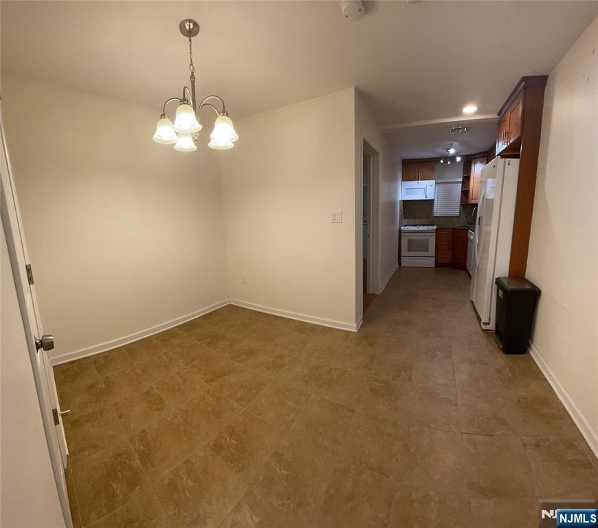 60 Passaic Street Garfield, NJ 07026 - Photo 9 of 14 a view of a livingroom with a stove