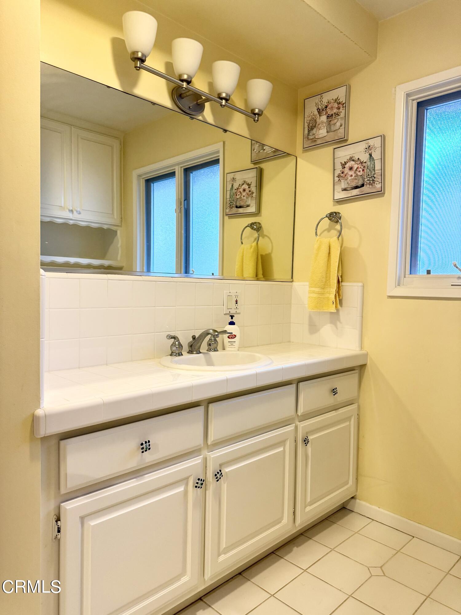 1123 Monte Verde Drive Arcadia, CA 91007 - Photo 12 of 16 a bathroom with a sink vanity and mirror