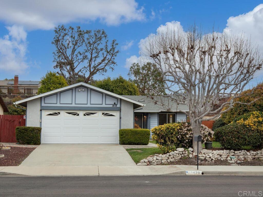 1478 Broken Hitch Road Oceanside, CA 92056 - Photo 1 of 1 a front view of a house with a yard