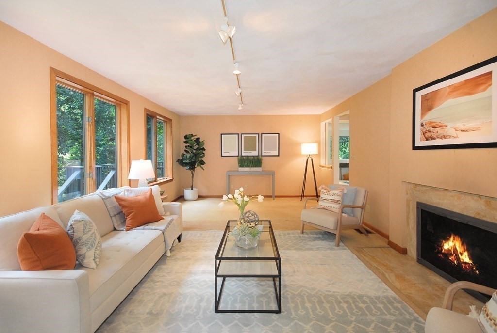 18 Washington Drive Acton, MA 01720 - Photo 12 of 29 a living room with furniture and a fireplace