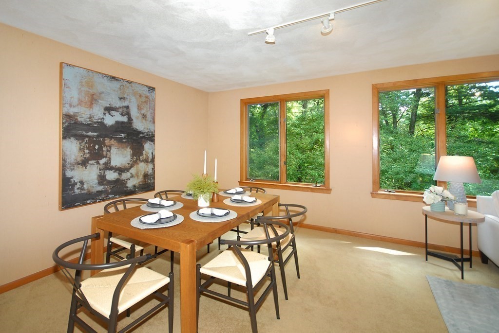 18 Washington Drive Acton, MA 01720 - Photo 15 of 29 a dining room with furniture and a large window
