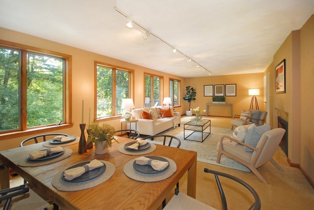 18 Washington Drive Acton, MA 01720 - Photo 16 of 29 a living room with furniture and large windows