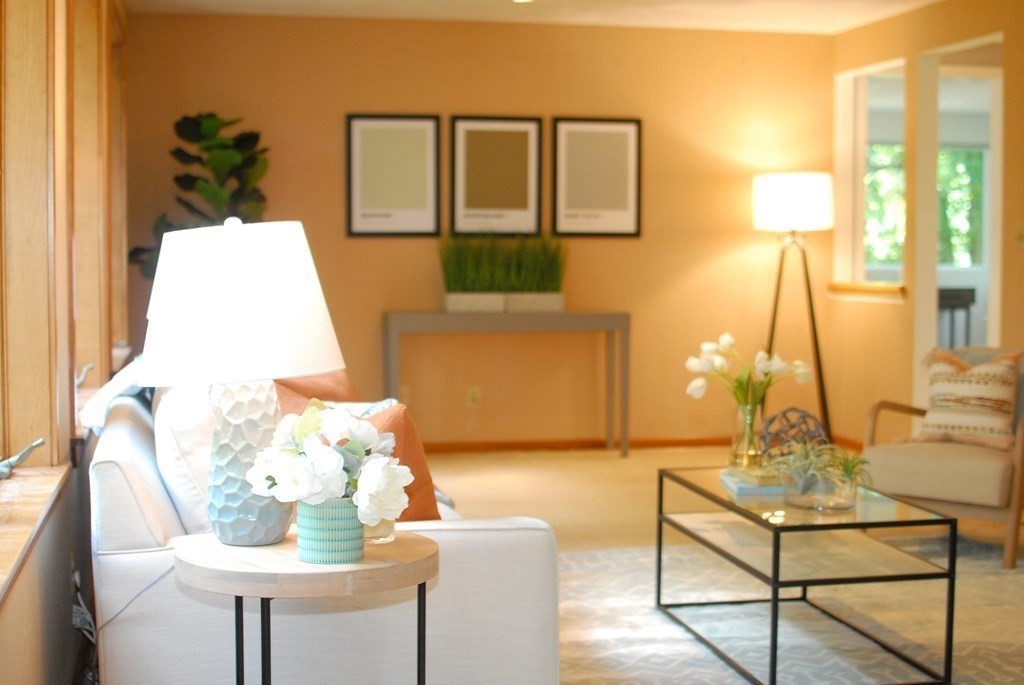 18 Washington Drive Acton, MA 01720 - Photo 17 of 29 a living room with a table and a couch