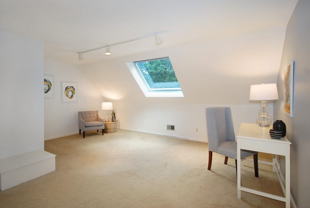 18 Washington Drive Acton, MA 01720 - Photo 22 of 29 a view of a workspace with furniture and a lamp