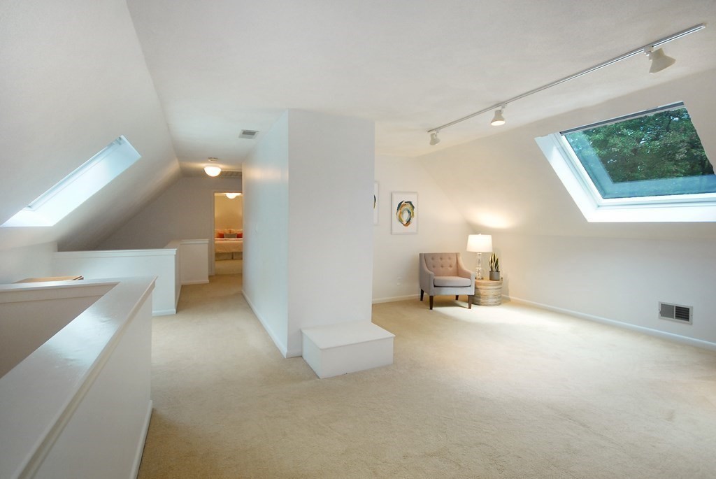 18 Washington Drive Acton, MA 01720 - Photo 23 of 29 a living room with furniture and a table