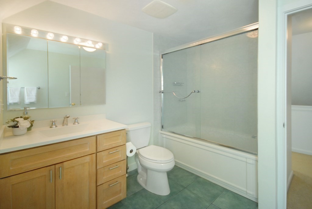 18 Washington Drive Acton, MA 01720 - Photo 26 of 29 a bathroom with a sink toilet and shower