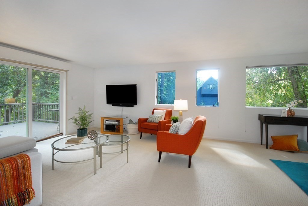18 Washington Drive Acton, MA 01720 - Photo 5 of 29 a living room with furniture and a flat screen tv