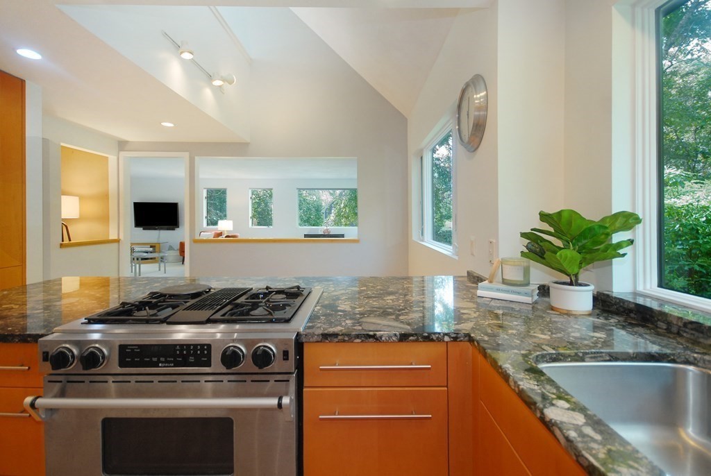 18 Washington Drive Acton, MA 01720 - Photo 8 of 29 a kitchen with stainless steel appliances granite countertop a sink stove and cabinets