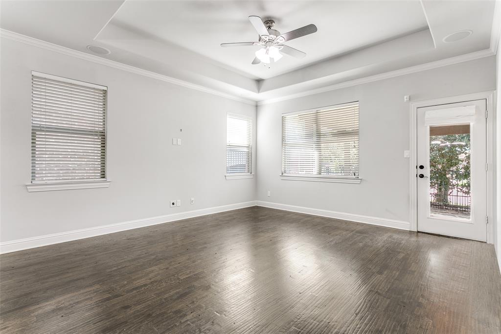 2221 Churchill Loop Grapevine, TX 76051 - Photo 11 of 26 a view of an empty room with wooden floor and a window