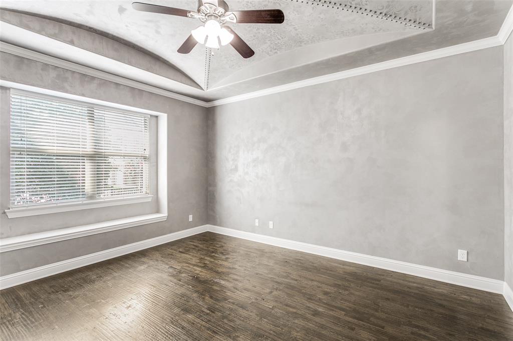 2221 Churchill Loop Grapevine, TX 76051 - Photo 12 of 26 a view of an empty room with wooden floor and a window