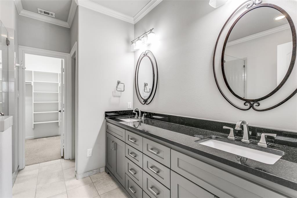 2221 Churchill Loop Grapevine, TX 76051 - Photo 13 of 26 a bathroom with a granite countertop double vanity sink and a mirror