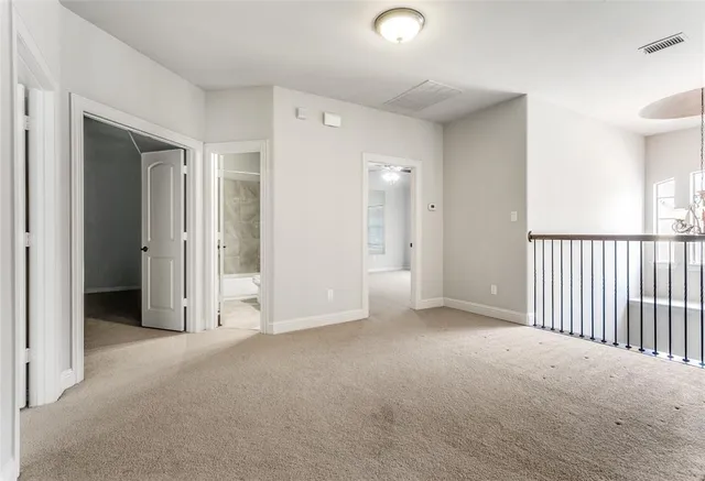 an empty room with closet area