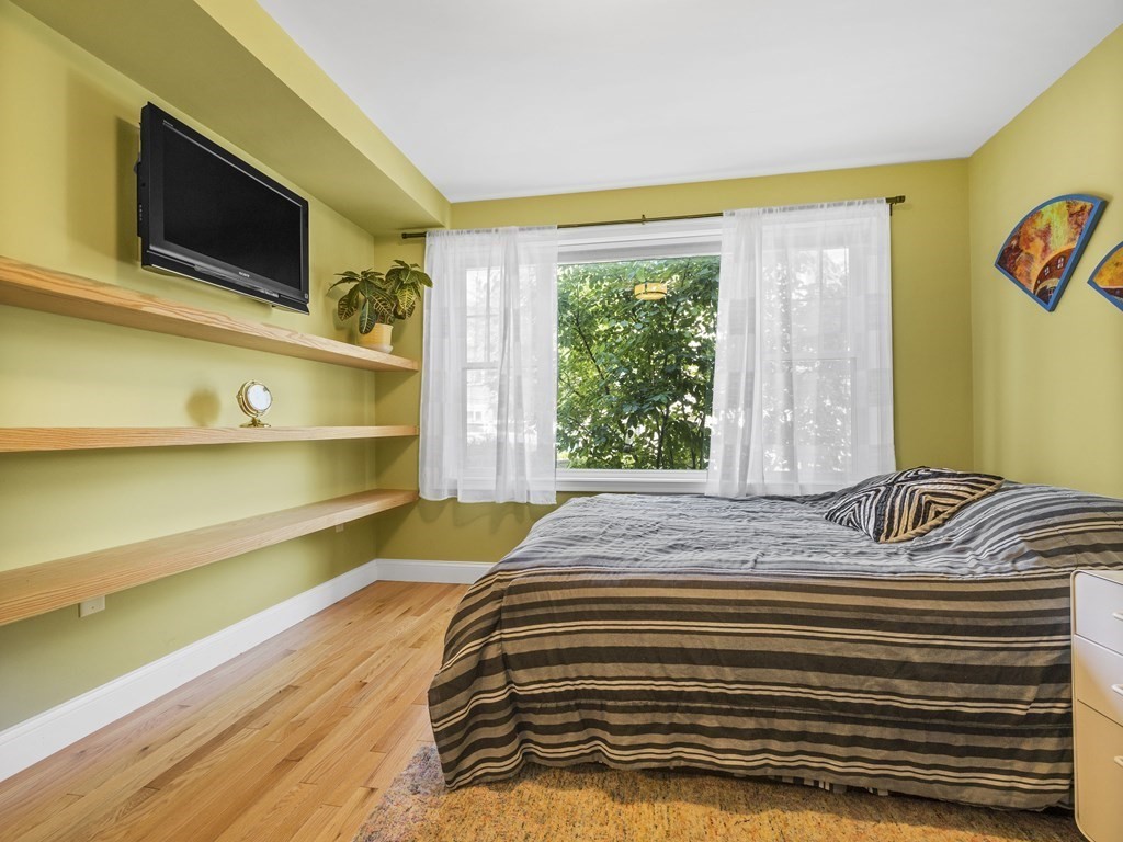 38 Webster Street, Unit 1 Needham, MA 02494 - Photo 20 of 35 a bedroom with a bed and flat screen tv